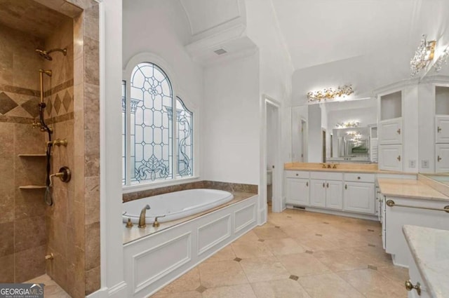 bathroom with independent shower and bath and vanity