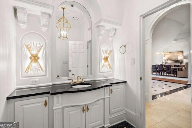 bathroom featuring vanity and an inviting chandelier