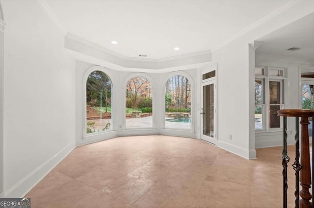 entryway featuring ornamental molding and a healthy amount of sunlight