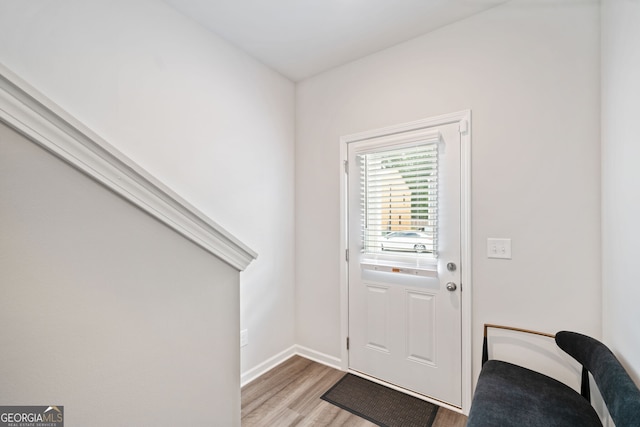 doorway to outside with light hardwood / wood-style flooring