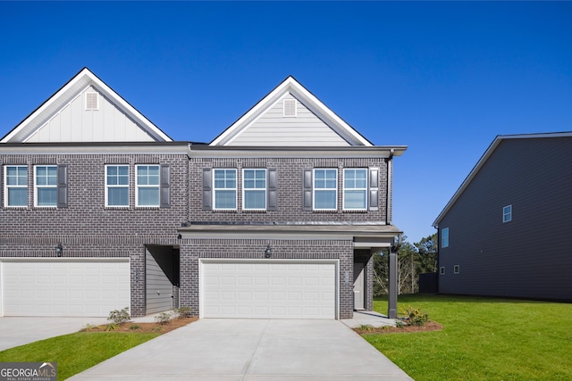 view of front of home featuring a garage and a front lawn