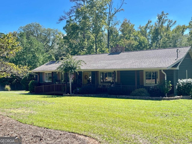 single story home with covered porch and a front lawn