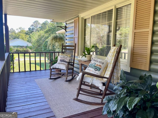 wooden terrace featuring a porch