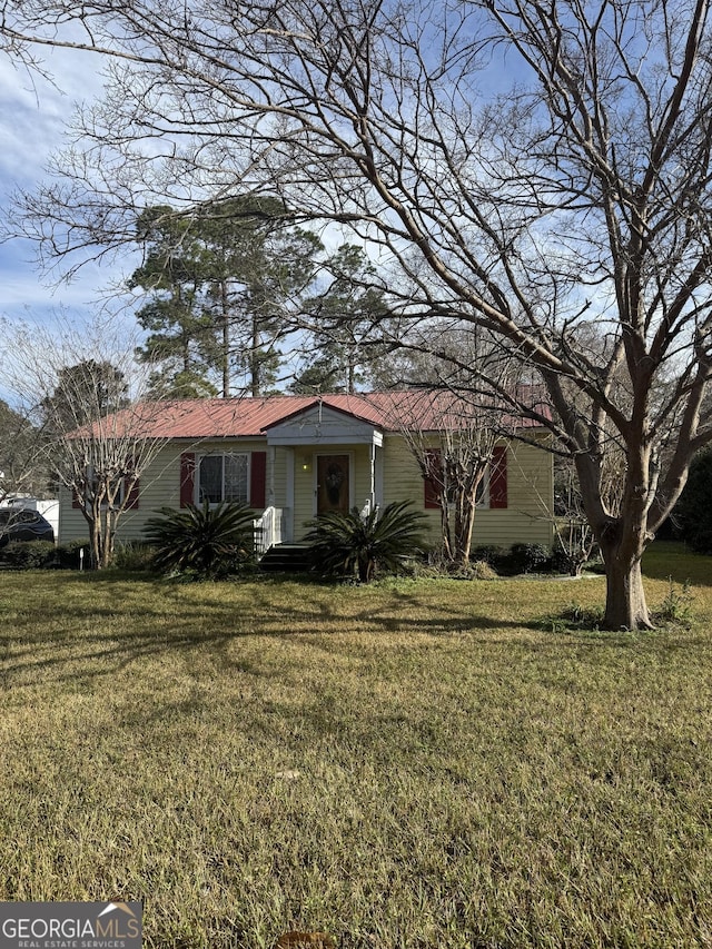 ranch-style house with a front lawn