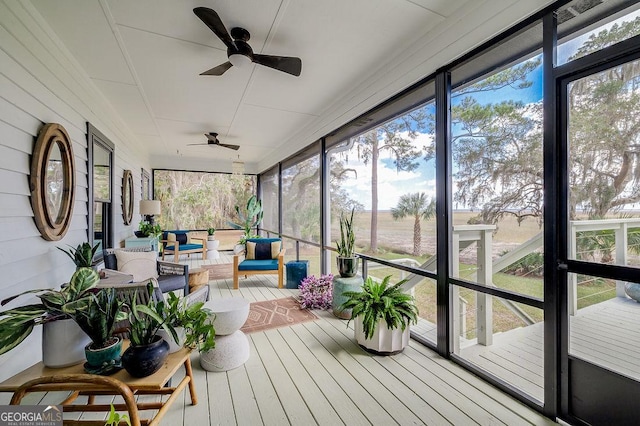 sunroom with a ceiling fan and a healthy amount of sunlight