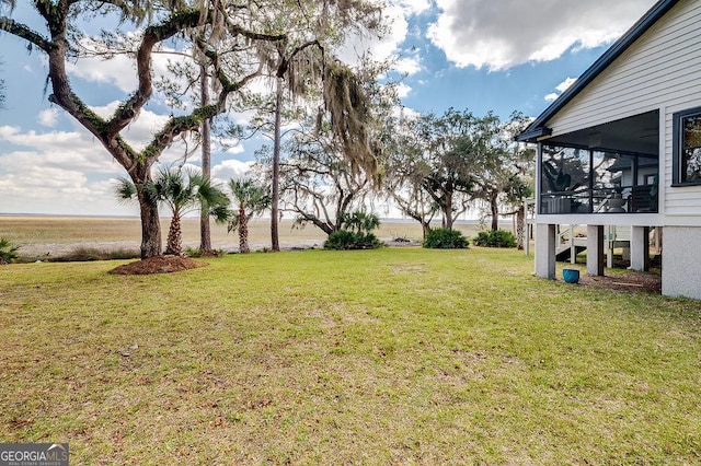 view of yard with a sunroom