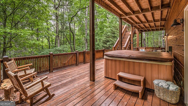 deck featuring a hot tub