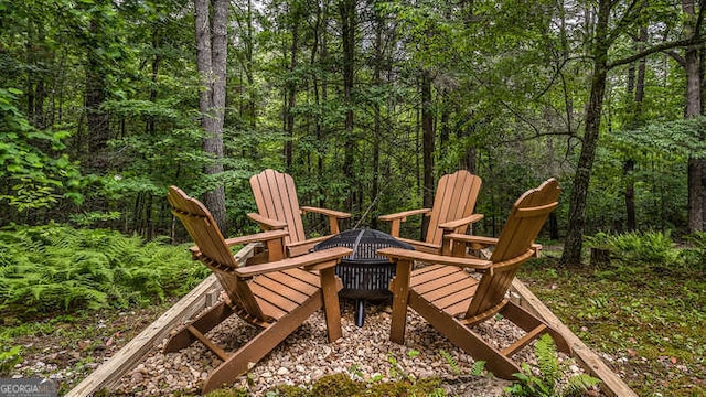 wooden terrace with a fire pit