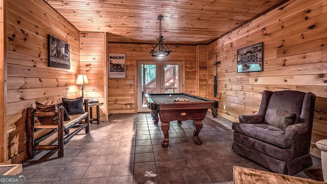 recreation room with wood ceiling, billiards, and wood walls