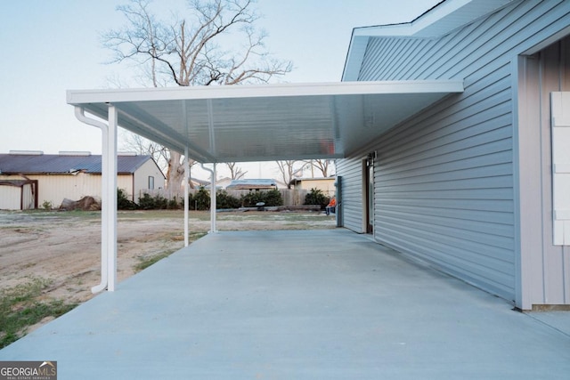 view of vehicle parking with a carport