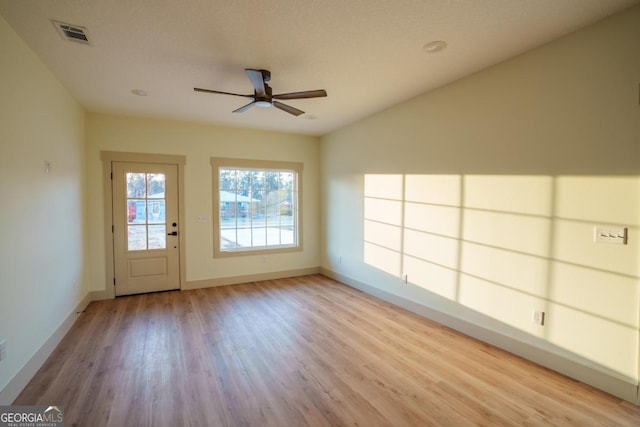 interior space featuring ceiling fan and light hardwood / wood-style flooring