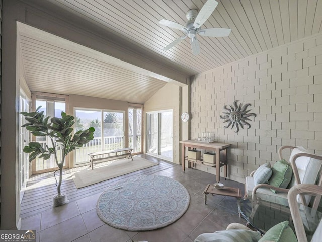 sitting room featuring tile patterned floors, vaulted ceiling, ceiling fan, and wood ceiling