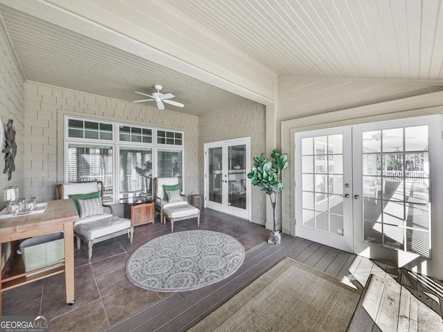 sunroom with ceiling fan, wooden ceiling, french doors, and lofted ceiling