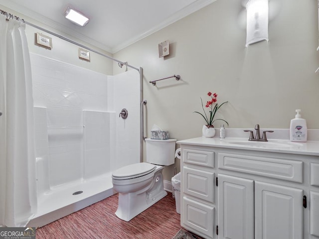 bathroom featuring toilet, wood-type flooring, a shower, crown molding, and vanity