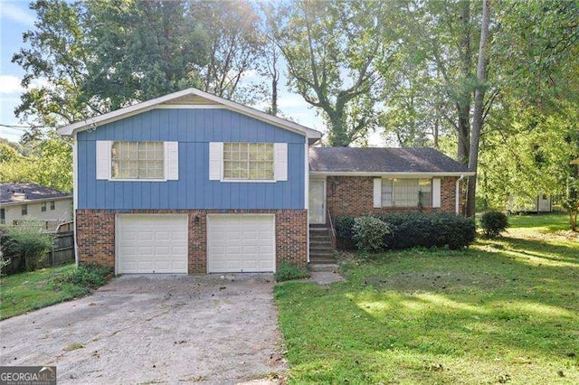 split level home featuring a garage and a front yard