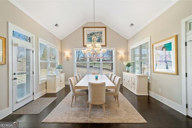 dining area featuring high vaulted ceiling, an inviting chandelier, and dark hardwood / wood-style flooring