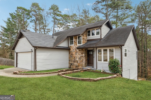 view of front of home with a front lawn and a garage