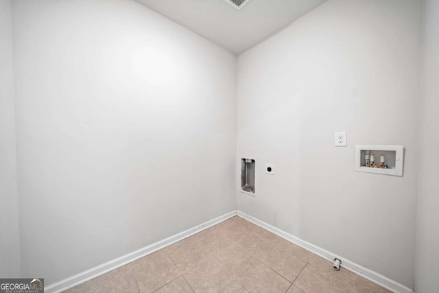 washroom featuring hookup for a gas dryer, hookup for an electric dryer, laundry area, washer hookup, and baseboards