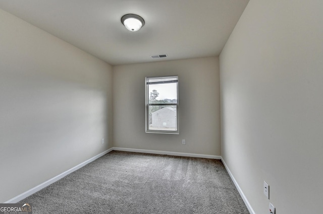 unfurnished room with carpet floors