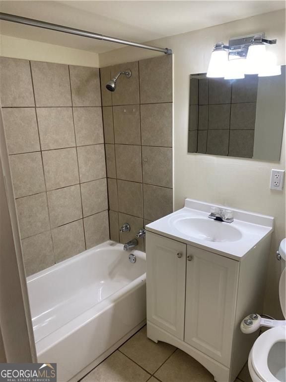 full bathroom with vanity, toilet, bathing tub / shower combination, and tile patterned flooring