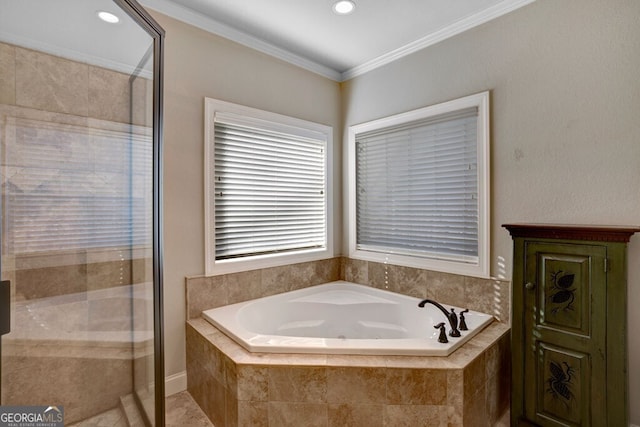 bathroom featuring crown molding and shower with separate bathtub