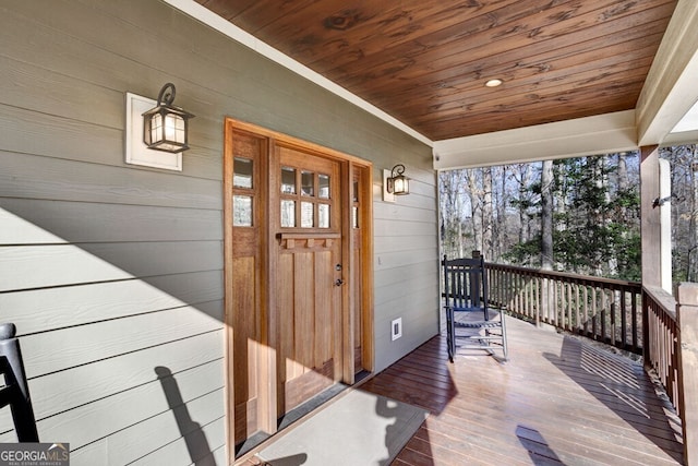 entrance to property featuring covered porch