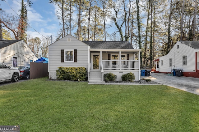 view of front facade with a front lawn and a porch