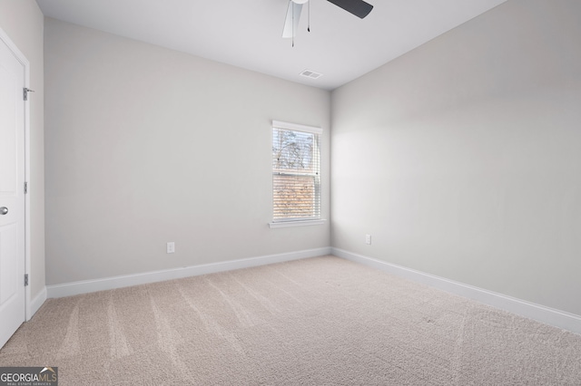 unfurnished bedroom with a ceiling fan, carpet flooring, visible vents, and baseboards