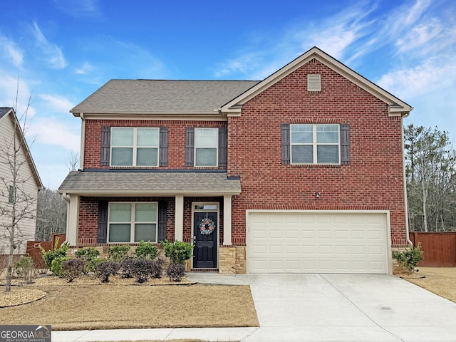 view of front facade with a shingled roof, brick siding, driveway, and an attached garage