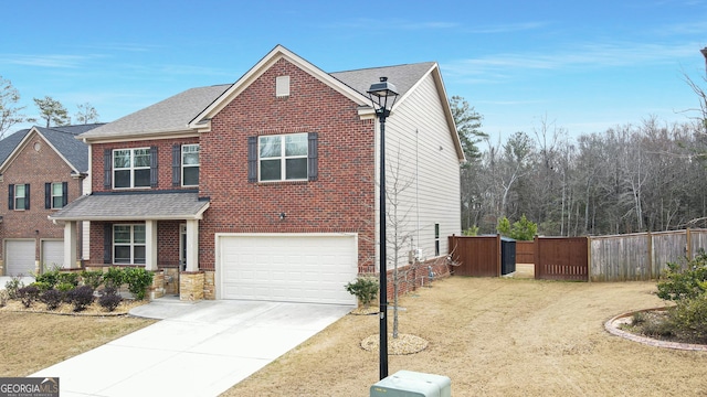 traditional-style house with a garage, brick siding, fence, concrete driveway, and roof with shingles