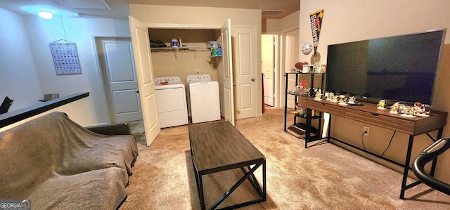 carpeted living room with independent washer and dryer