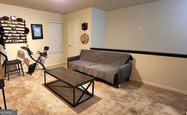 sitting room featuring light colored carpet