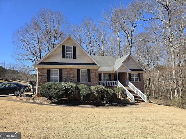 view of front of house featuring a front yard and a porch