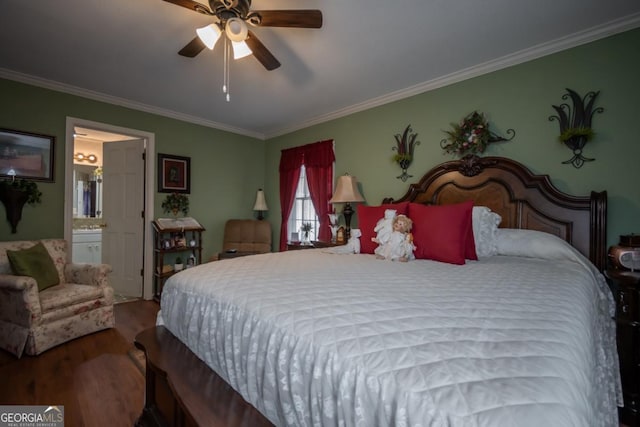 bedroom with crown molding, ensuite bathroom, a ceiling fan, and wood finished floors