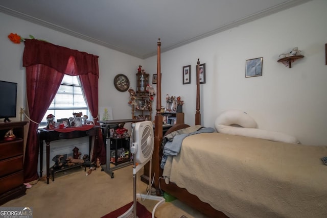 bedroom with ornamental molding and carpet