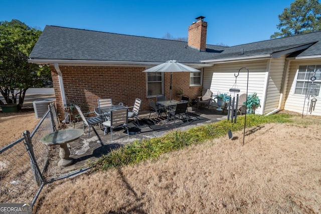 back of house featuring cooling unit and a patio area