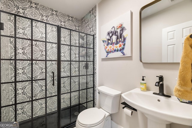 bathroom featuring sink and toilet