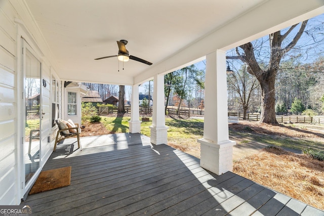 wooden terrace featuring ceiling fan