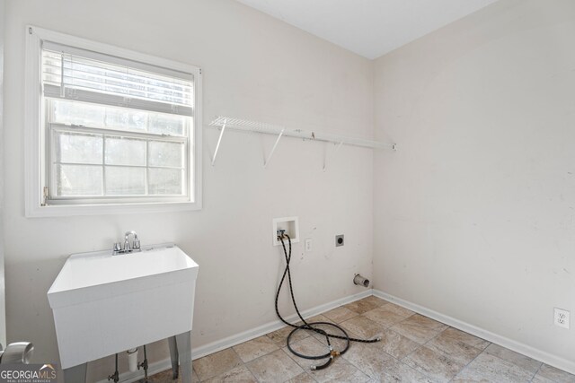 laundry room with sink, hookup for a washing machine, and electric dryer hookup