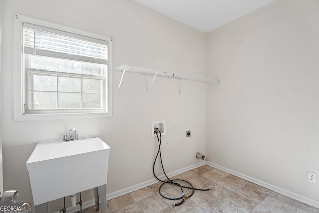 123 Stratmore Pl, Stockbridge, GA 30281 - washroom featuring hookup for an electric dryer, hookup for a washing machine, and light stone finish flooring