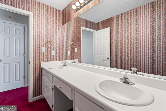 bathroom featuring vanity and a textured ceiling