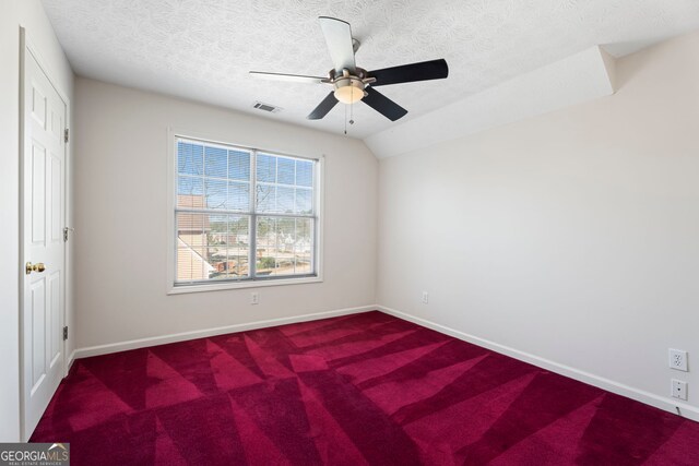 123 Stratmore Pl, Stockbridge, GA 30281 - unfurnished bedroom with a textured ceiling, carpet floors, and a ceiling fan