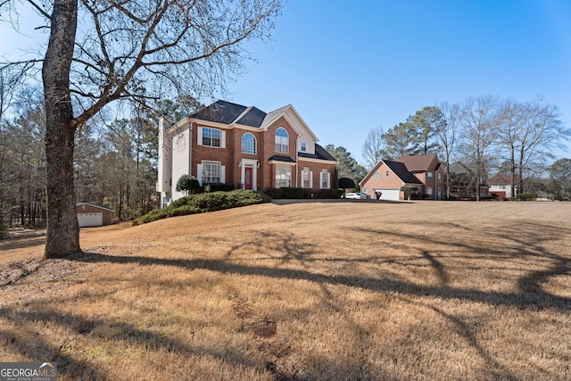 view of front facade with a garage and a front lawn