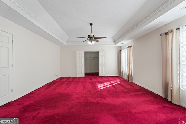 123 Stratmore Pl, Stockbridge, GA 30281 - unfurnished bedroom with carpet flooring, a raised ceiling, a ceiling fan, and a closet