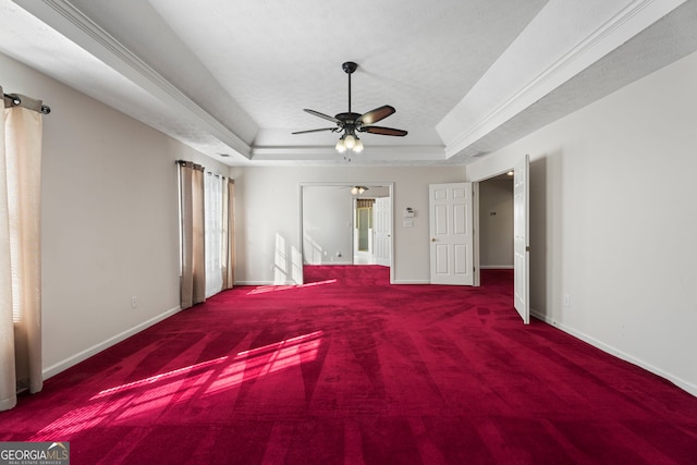 123 Stratmore Pl, Stockbridge, GA 30281 - unfurnished bedroom with a tray ceiling, carpet floors, connected bathroom, and ceiling fan