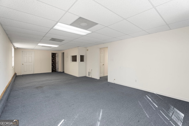 123 Stratmore Pl, Stockbridge, GA 30281 - spare room with a paneled ceiling and dark carpet