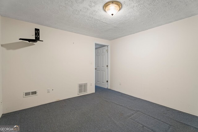 123 Stratmore Pl, Stockbridge, GA 30281 - carpeted spare room with a textured ceiling