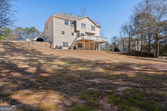back of property featuring a deck