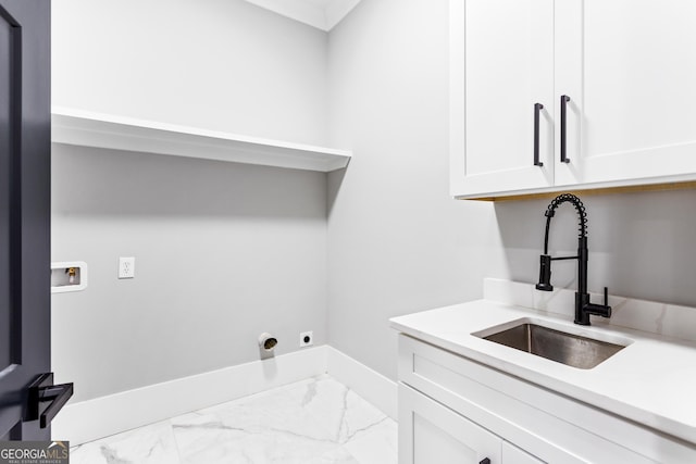 washroom with hookup for a washing machine, a sink, baseboards, marble finish floor, and cabinet space