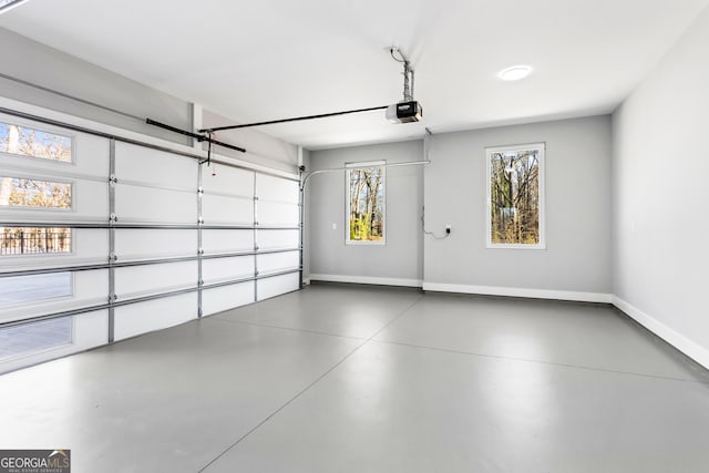 garage featuring baseboards and a garage door opener